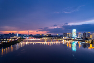 Naklejka premium Aerial photography of the night scene on both sides of the Xiangjiang River in Zhuzhou, China