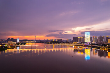 Obraz premium Aerial photography of the night scene on both sides of the Xiangjiang River in Zhuzhou, China