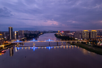 Naklejka premium Aerial photography of the night scene on both sides of the Xiangjiang River in Zhuzhou, China