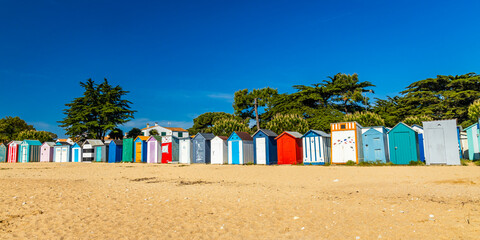 Multi-colored huts of the beach of La Boirie on the Oleron island in Saint-Denis-d'Oléron, France