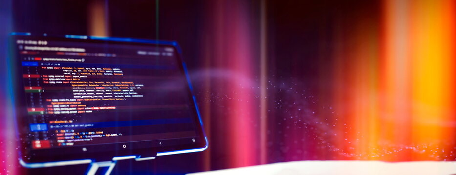 Work from home. Programmer coding code on notebook screen at home.