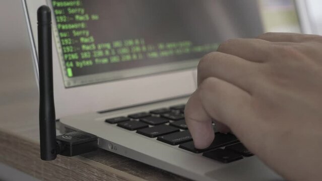 A laptop screen shows a lot of numbers and letters. The laptop is open to a page with a lot of information