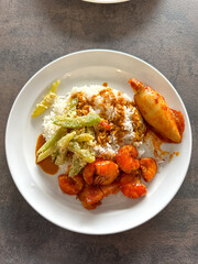 Malaysian styled complete meal for lunch or dinner called Nasi Campur.  It is plain white rice served with variety of dishes.