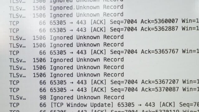 A laptop screen shows a lot of numbers and letters. The laptop is open to a page with a lot of information