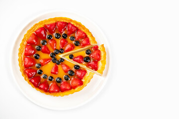 Delicious and appetizing cheesecake with strawberries and blueberries, place for text, top view. Menu for restaurant and cafe.