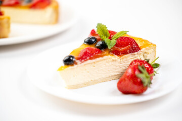 There's a slice of strawberry cheesecake on the plate. Menu for cafe, white background.