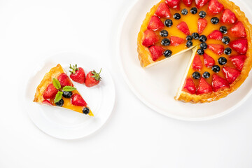 A piece of cheesecake with strawberry on a plate top view. Menu for cafe, white background.
