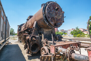 Steam locomotive in very bad condition, completely rusty and abandoned on the unused tracks at Uşak Rail way station.