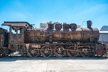 Steam locomotive in very bad condition, completely rusty and abandoned on the unused tracks at Uşak Rail way station.