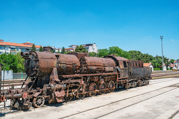 Steam locomotive in very bad condition, completely rusty and abandoned on the unused tracks at Uşak Rail way station.