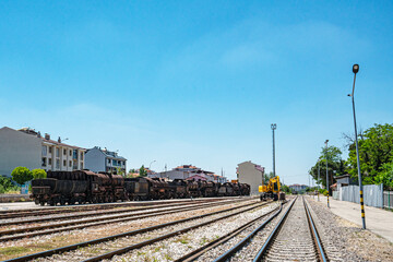 Fototapeta premium Steam locomotive in very bad condition, completely rusty and abandoned on the unused tracks at Uşak Rail way station.