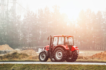 Industrial tractor on the highway road © AlexGo