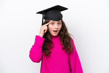 Little student girl wearing a graduated hat isolated on pink background intending to realizes the solution