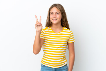 Little caucasian girl isolated on white background smiling and showing victory sign