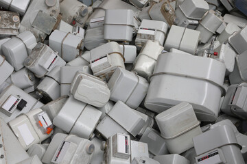used methane gas meters dumped haphazardly after removal and ready for landfill disposal