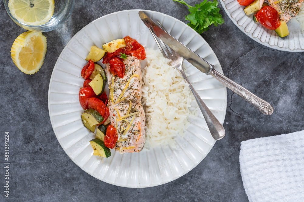 Poster oven baked salmon and vegetables with rice