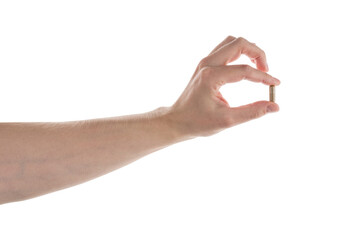 Male hand show brown pill isolated on white
