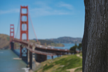World famous red steel suspension bridge in San Francisco port entrance with Golden Gate State park...