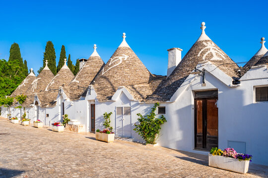 Famous historical old dry stone trulli houses with conical roofs in Alberobello, Italy.