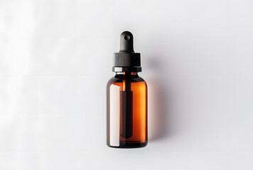 Fototapeta premium Amber glass dropper bottle with black cap isolated on white background