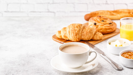 Breakfast with coffee and croissants