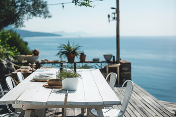 Obraz premium Whitewashed Patio With Ocean View and Wooden Table