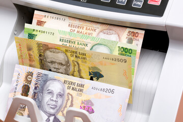 Malawian kwacha in a counting machine