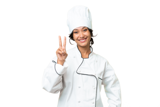 Young chef Argentinian woman over isolated background smiling and showing victory sign