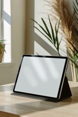 Fototapeta premium A minimalist mockup of a tablet on a desk, ideal for display purposes