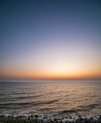Sunset sea vertical view landscape horizon beautiful summer season shore nobody wind wave cool holiday look calm big sunset sky twilight evening day time nature tropical coast ocean water travel