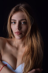 Beauty portrait of young blonde woman. Sexy model posing in studio. Portrait of beautiful girl. Beauty woman face closeup. Pretty girl portrait. Sensual look. Beautiful female portrait.