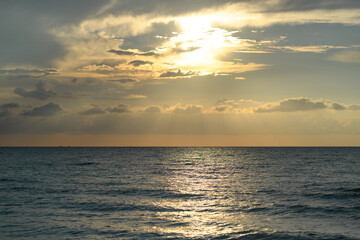 Sunrise seascape with clouds. Sunrise sea on tropical beach. Landscape of beautiful beach. Beautiful sunset at sea. Ocean sunset on sky background with colorful clouds.