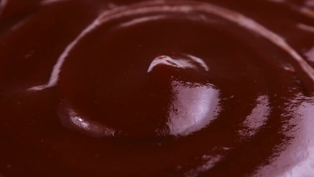 Tasty spicy barbecue sauce circle rotation close up