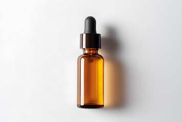 Fototapeta premium Amber glass dropper bottle with black cap isolated on white background