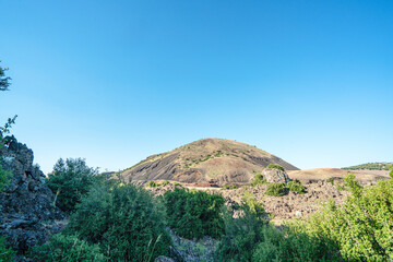 The scenic views of The Kula Divlit Volcanic Park, located in the Kula-Salihli Geopark,  Kula district, contain all of the landforms that resulted from the third stage of volcanic activity.