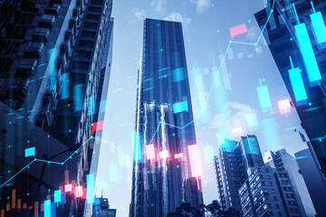 Urban skyscrapers with a double exposure of glowing financial graphs, in a concept of market analysis on a blue background