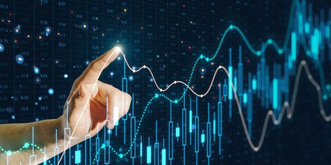 A hand interacting with glowing financial graphs, representing a concept of data analysis on a dark background with digital overlays