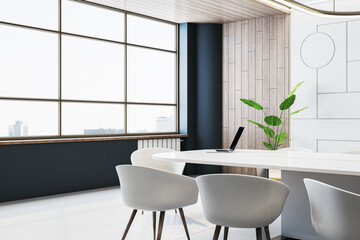 Modern office interior with a white table, chairs, laptop, plant, wooden and blue walls, and city view through large windows. 3D Rendering