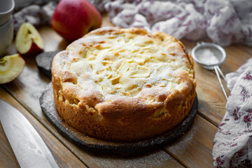 Apple pie for breakfast. Delicious apple pie on a wooden table. Close-up
