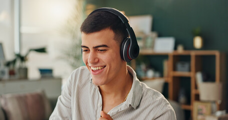 Headphones, happy and man with music in home for online audio, entertainment and listening to...