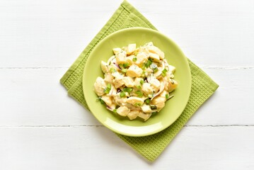 Potato salad with egg, pickle, green onion with mayonnaise and yogurt dressing