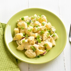 Potato salad with egg, pickle, green onion with mayonnaise and yogurt dressing