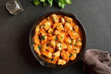 Delicious chicken tikka masala curry in cast iron pan