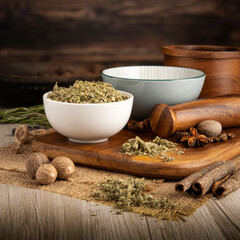 MARSHMALLOW LEAF DRIED on wooden table background. Herbs, spices and dried food baking ingredient. Mortar and different spices. Cottage kitchen. Product Photography