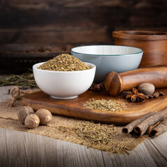 MARJORAM DRIED HERB on wooden table background. Herbs, spices and dried food baking ingredient. Mortar and different spices. Cottage kitchen. Product Photography