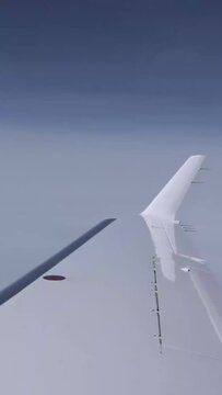 Airplane Wing view Outside clouds sky business jet aircraft