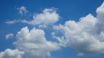 Bright blue sky and white clouds for use as the background