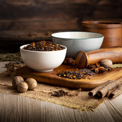 ANCHO CHILLI PEPPER FLAKES on wooden table background. Herbs, spices and dried food baking ingredient. Mortar and different spices. Cottage kitchen. Product Photography