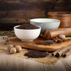 ISOT CHILLI - TURKISH CHILLI on wooden table background. Herbs, spices and dried food baking ingredient. Mortar and different spices. Cottage kitchen. Product Photography