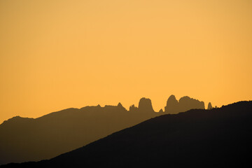 Sunrise over the jagged peaks of Les Aiguilles de Bavella in Corsica
